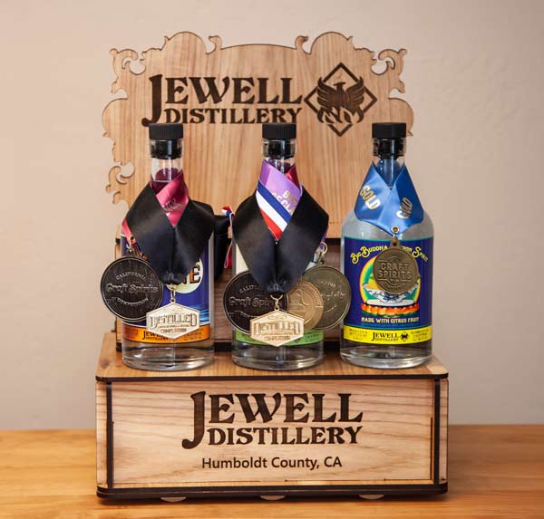 three bottles with medals on them