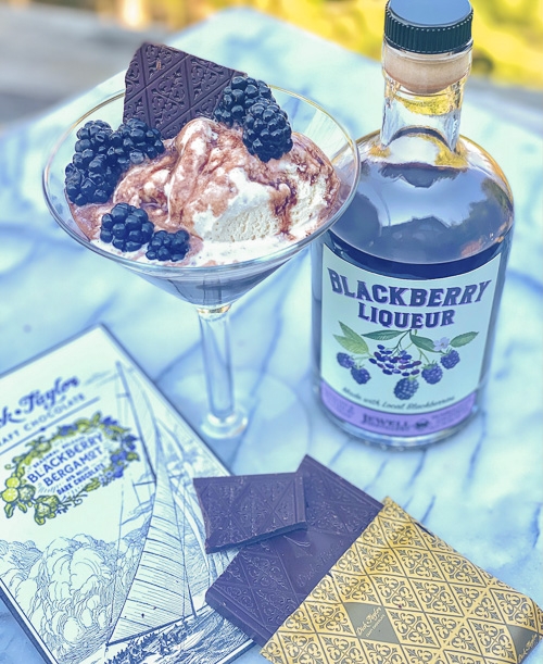 bottle of blackberry liqueur and chocolate and a bowl of ice cream