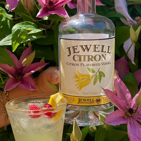 jewell citron bottl with a martini glass and garnish